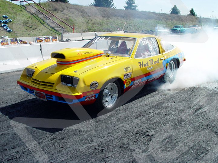 Car doing a burnout at the starting line
